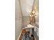Cozy powder room featuring a pedestal sink, unique wallpaper, and a decorative mirror at 18 Fernandina St, Mount Pleasant, SC 29464