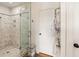Elegant bathroom with marble walk-in shower, glass enclosure and towel rack at 18 Fernandina St, Mount Pleasant, SC 29464