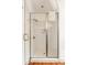 Modern glass shower stall with white tile, stainless steel handle, and rainfall showerhead at 18 Fernandina St, Mount Pleasant, SC 29464