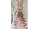 Stairway with a red camouflage carpet and white trim leading to the upper floor at 18 Fernandina St, Mount Pleasant, SC 29464