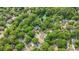 Aerial view of a leafy neighborhood with mature trees surrounding houses and streets at 1939 Oak Tree Ln, Mount Pleasant, SC 29464