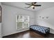 Cozy bedroom with natural light and sleek wood flooring at 1939 Oak Tree Ln, Mount Pleasant, SC 29464