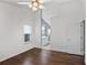 This bedroom features wood flooring, a ceiling fan, and access to a bathroom at 1939 Oak Tree Ln, Mount Pleasant, SC 29464
