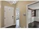 Well-lit foyer with a white front door and access to multiple rooms at 1939 Oak Tree Ln, Mount Pleasant, SC 29464