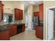 Kitchen featuring dark wood cabinets, stainless steel appliances, and tile backsplash at 1939 Oak Tree Ln, Mount Pleasant, SC 29464