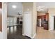 View from hallway into living room with fireplace, french doors, and wood floors at 1939 Oak Tree Ln, Mount Pleasant, SC 29464