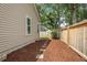 Narrow side yard featuring wood fencing and landscaping at 1939 Oak Tree Ln, Mount Pleasant, SC 29464