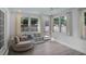 Inviting sunroom with ample natural light, cozy seating, and neutral decor at 1939 Oak Tree Ln, Mount Pleasant, SC 29464