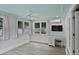 Bright sunroom featuring a workspace, neutral decor, and many windows at 1939 Oak Tree Ln, Mount Pleasant, SC 29464