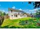 Spacious backyard featuring lush green lawn, patio, and privacy fence at 195 Highwoods Plantation Ave, Summerville, SC 29485