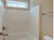 Bathroom with tub, shower head and small window for natural light at 195 Highwoods Plantation Ave, Summerville, SC 29485