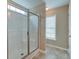 Bathroom featuring a glass shower enclosure and tile flooring at 195 Highwoods Plantation Ave, Summerville, SC 29485