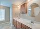 Bathroom featuring a double vanity, updated fixtures, and tile flooring at 195 Highwoods Plantation Ave, Summerville, SC 29485