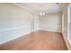 Spacious dining room featuring hardwood floors, elegant lighting, and neutral paint at 195 Highwoods Plantation Ave, Summerville, SC 29485