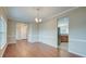 Bright dining area with hardwood floors and view to the kitchen and entrance at 195 Highwoods Plantation Ave, Summerville, SC 29485