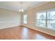 Bright dining room with hardwood floors, neutral walls, and multiple windows providing natural light at 195 Highwoods Plantation Ave, Summerville, SC 29485