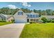 Charming two-story home with a well-manicured lawn and inviting curb appeal at 195 Highwoods Plantation Ave, Summerville, SC 29485