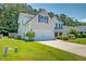 Charming two-story home featuring a two-car garage, well-manicured lawn, and inviting curb appeal at 195 Highwoods Plantation Ave, Summerville, SC 29485