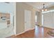 Inviting foyer showcasing hardwood floors, a chandelier, and views of the kitchen at 195 Highwoods Plantation Ave, Summerville, SC 29485