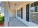 Covered front porch featuring classic columns, providing a perfect spot for relaxing at 195 Highwoods Plantation Ave, Summerville, SC 29485