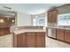 Open-concept kitchen includes modern appliances, ample cabinetry, and a breakfast bar at 195 Highwoods Plantation Ave, Summerville, SC 29485