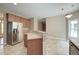Spacious kitchen boasts stainless steel appliances and an island, perfect for entertaining at 195 Highwoods Plantation Ave, Summerville, SC 29485