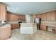 Well-lit kitchen with tile floors, stainless steel appliances, ample counter space, and wood cabinets at 195 Highwoods Plantation Ave, Summerville, SC 29485