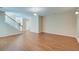 Open living space with hardwood floors, staircase, and neutral color palette at 195 Highwoods Plantation Ave, Summerville, SC 29485