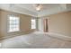 A spacious main bedroom with large windows and a ceiling fan at 195 Highwoods Plantation Ave, Summerville, SC 29485