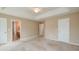 A spacious main bedroom with large windows and a ceiling fan at 195 Highwoods Plantation Ave, Summerville, SC 29485