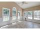 Bright sunroom features tile flooring, neutral paint, and several windows to let in plenty of natural light at 195 Highwoods Plantation Ave, Summerville, SC 29485