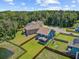 Aerial of home with fenced backyard adjacent to pond and treed area at 203 Plowden Mill Ct, Summerville, SC 29485
