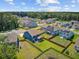Areal view of neighborhood featuring multiple homes, ponds, and privacy fences at 203 Plowden Mill Ct, Summerville, SC 29485