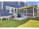 Spacious backyard with a screened-in porch and grilling area, perfect for entertaining and outdoor activities at 203 Plowden Mill Ct, Summerville, SC 29485