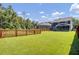 Large, fenced backyard with a well-maintained lawn, offering privacy and space for recreation at 203 Plowden Mill Ct, Summerville, SC 29485