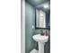 Clean bathroom with a pedestal sink and minimalist decor at 203 Plowden Mill Ct, Summerville, SC 29485