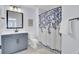 Bathroom with a vanity, toilet, and shower with a decorative blue and white floral shower curtain at 203 Plowden Mill Ct, Summerville, SC 29485