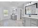 Bathroom featuring double vanities with white countertops, grey cabinetry, and modern black fixtures, offering a serene space at 203 Plowden Mill Ct, Summerville, SC 29485