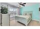 Comfortable bedroom with a ceiling fan, neutral carpet, and great natural light from a large window at 203 Plowden Mill Ct, Summerville, SC 29485