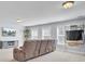 The bonus room offers comfortable seating, a large television, and ample space for entertaining guests at 203 Plowden Mill Ct, Summerville, SC 29485