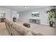 Open bonus room with comfortable seating, media console, and bright lighting, ideal for Gathering entertainment at 203 Plowden Mill Ct, Summerville, SC 29485
