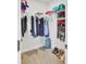 Walk-in closet featuring shelving, hanging clothes, shoes, and additional storage, maximizing space and organization at 203 Plowden Mill Ct, Summerville, SC 29485