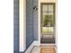 Stylish front door with glass panels, offering an elegant entry into the home at 203 Plowden Mill Ct, Summerville, SC 29485