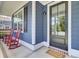 Inviting front porch showcasing a cozy seating area and a welcoming entrance at 203 Plowden Mill Ct, Summerville, SC 29485