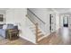 Hallway with staircase and open view to a bathroom at 203 Plowden Mill Ct, Summerville, SC 29485