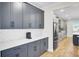 Modern kitchen showcasing gray cabinets, stylish backsplash, and stainless steel appliances at 203 Plowden Mill Ct, Summerville, SC 29485