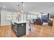 Bright, open living room with a fireplace, hardwood floors, and plenty of natural light at 203 Plowden Mill Ct, Summerville, SC 29485