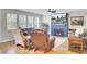Cozy living room with hardwood floors, fireplace, and lots of natural light at 203 Plowden Mill Ct, Summerville, SC 29485