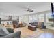 Open-concept living room with hardwood floors and an adjacent kitchen area at 203 Plowden Mill Ct, Summerville, SC 29485