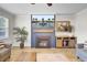 Bright living room with fireplace and entertainment center at 203 Plowden Mill Ct, Summerville, SC 29485